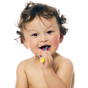 small child with toothbrush