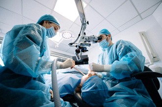 a dentist conducting surgery on a patient
