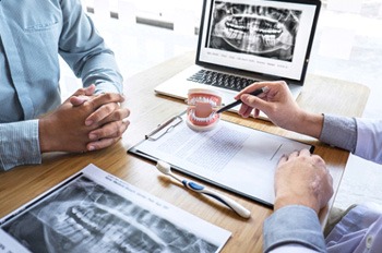 a dentist consulting with a patient