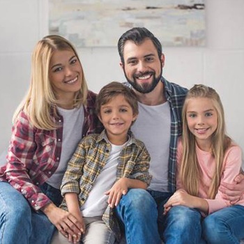 Smiling family portrait at home