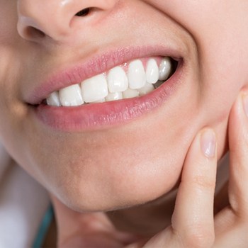 Close-up of woman with tooth pain