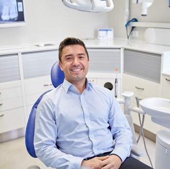 Man smiling in dental chair