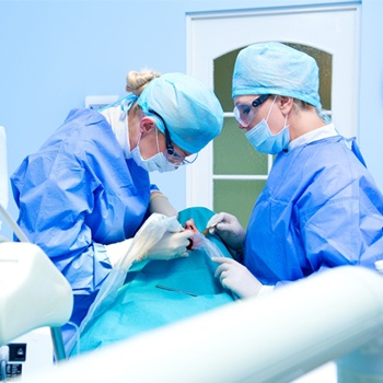Dentists performing dental work on a patient