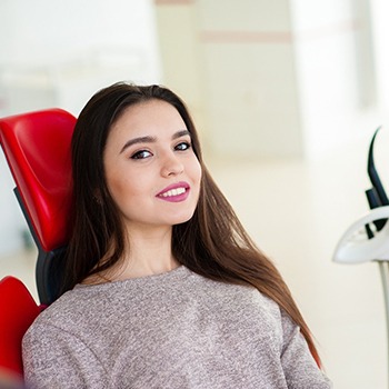 woman visiting dentist office smiling