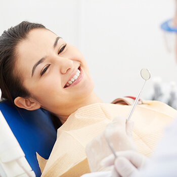 woman getting teeth whitening