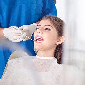 woman getting oral cancer screening