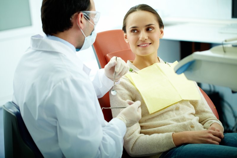 Patient smiling at her dentist in Crown Point