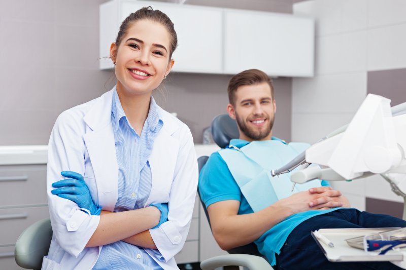 dentist and patient smiling in Crown Point