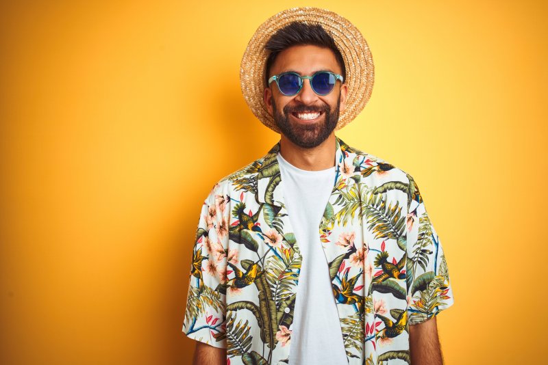 Smiling man wearing floral shirtd