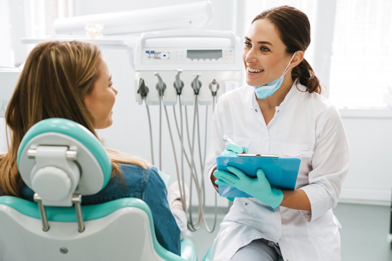 A dentist in Crown Point treating a patient