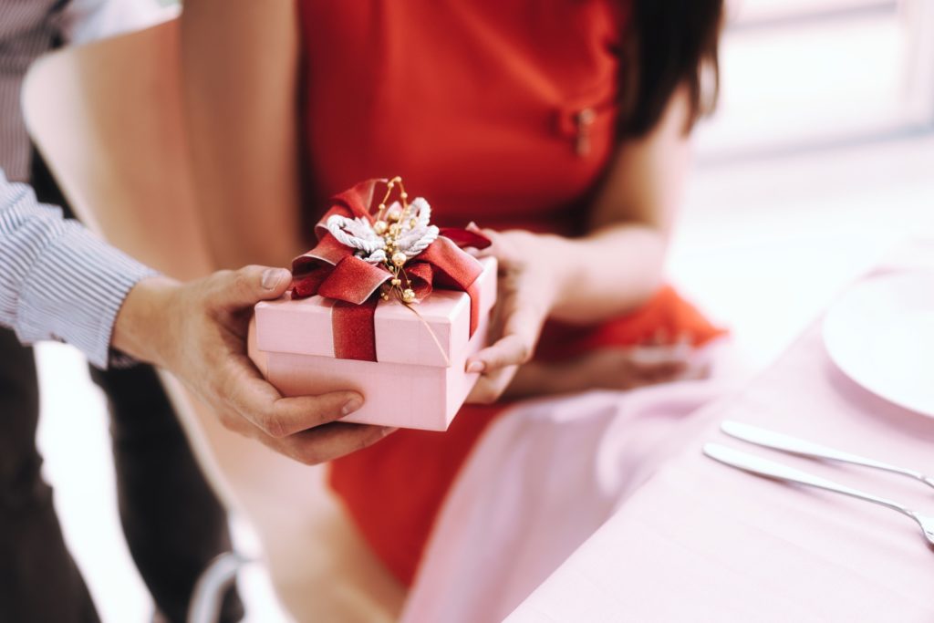 Closeup of pink box with red bow on Valentine's Day