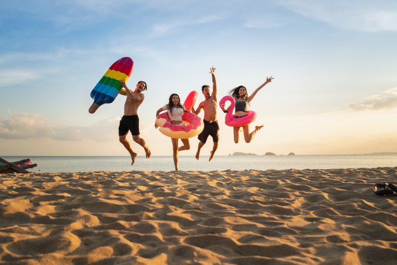 family playing on a beach