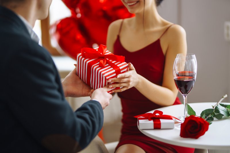 A couple exchanging gifts on Valentine’s Day